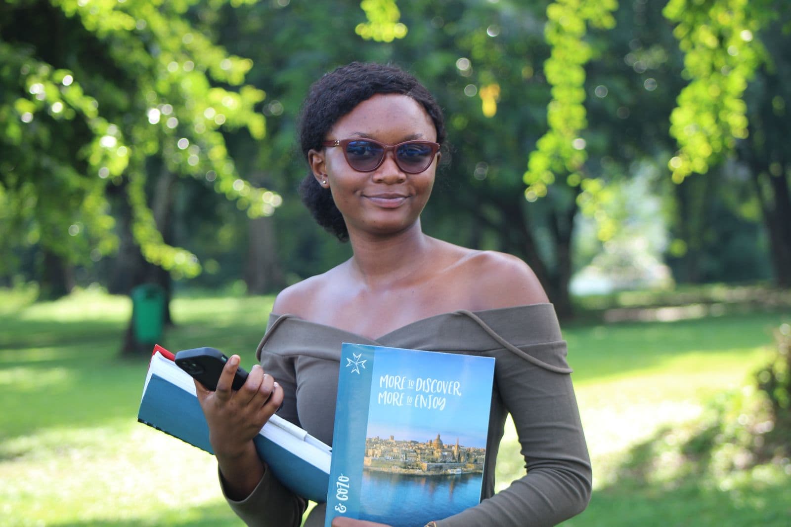 Ghanaian student holding study books in Kumasi
